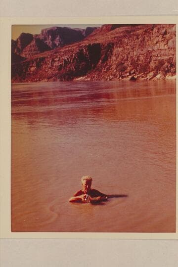 Gordon Avil fills canteen from the Silvery Colorado. Camp above Mile 217 Rapid