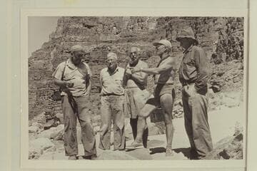 Looking over the rapid at Mile 24.5. Left to right: Sanderson, Desloge, Masland, Marston and Taylor