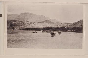 The Grand Canyon Survey party leaving Lees Ferry. Canvas boat "Mojave" at the left