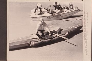 Alexander "Zee" Grant and his kayak "Escalante" in which he made a transit of the Grand Canyon in 1941. The two Nevills sadirons are in the background
