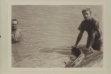 Frank Barnes at left and Duncan Harold McDermid. Lees Ferry with the sunken launch "Canopy." Enlarged from negative in Waller collection