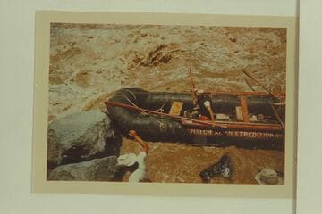 Pontoon No. 2 of the Don Hatch party, Vulcan Rapid. The effort is being made to clear the rocks after lining the upper part of the rapid. Boatmen are Galloway and Allan