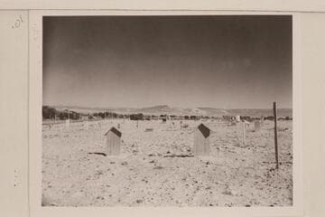 Graves of Galloway and his wife at Vernal cemetery. Split Mountain in distance