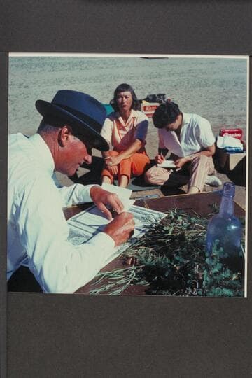 Bishop Wells makes out the wedding papers. Dorothy Aleson and Nina Robison in the background prepare the news. The Chapel; Mile 118 1/2; Glen Canyon