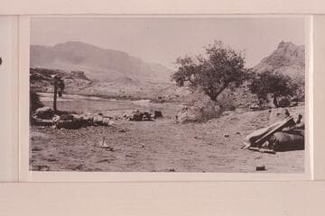 Camp of the LaRue Glen Canyon party at Lees Ferry. Note the hull of the "Navajo" at left center