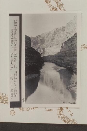 Downstream view of Thirty-Mile Damsite. CAmera location is Mile 186.4 right bank. The fan and riffle at center are at the mouth of Cove Canyon at Mile 186.2. Photo from LaRue album 1