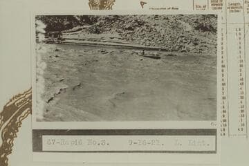 Ellsworth Kolb in U. S. Geological Survey skiff in Rapid #3. Rapid #3 heads at Mile 211.65 and drops 4' in .15 miles