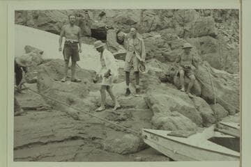 The meeting of the Aleson and Nevills parties, Separation Canyon. Charles Larabee at left, then Harry Aleson, Lewis West, and Del Reed