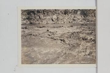 Pipe Creek Rapid. Boat of the Dusty Dozen crew back of wave left of center with just the boatman's head showing