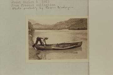 Frank Dodge stepping into the canvas boat "Mojave." Lees Ferry. From Freeman collection; probably by Roger Birdseye