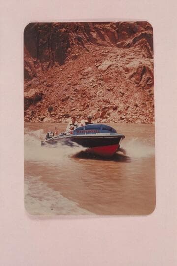 Shakedown cruise into Glen Canyon. Rod Sanderson at the wheel, Harvey Butchart sits astern and Lodell Mathews sits in the cockpit